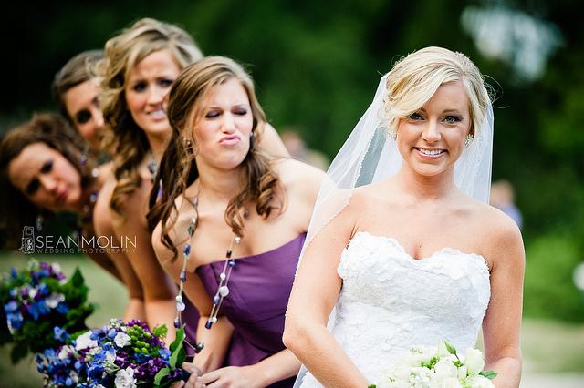 Photo of bride with three bridesmaids and one very jealous one