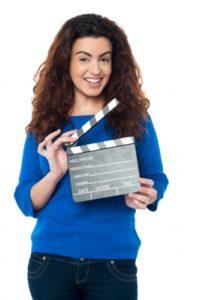 Woman holding film slate