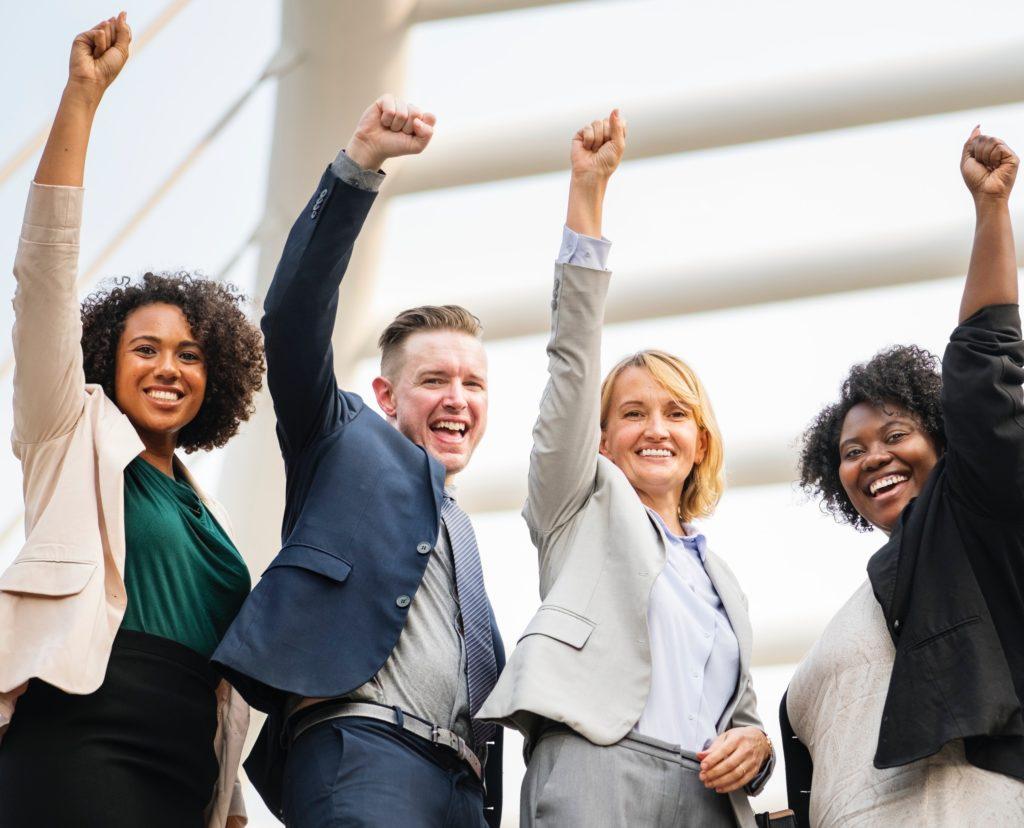 four people raise hands in support of your cause