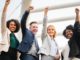 four people raise hands in support of your cause