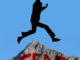 Man jumping over mountain