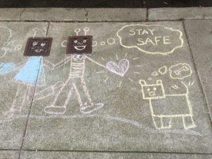 Chalk drawing family sharing meaning to stay safe