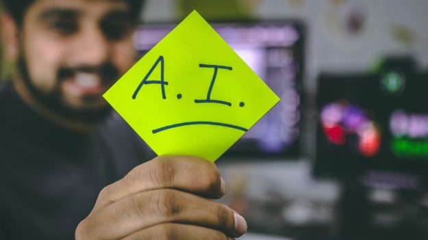 Person holding AI post-it note