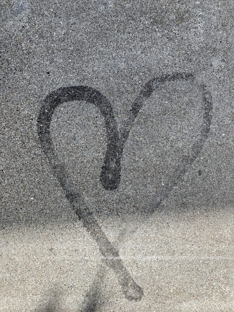 Simple heart graffiti on a wall.