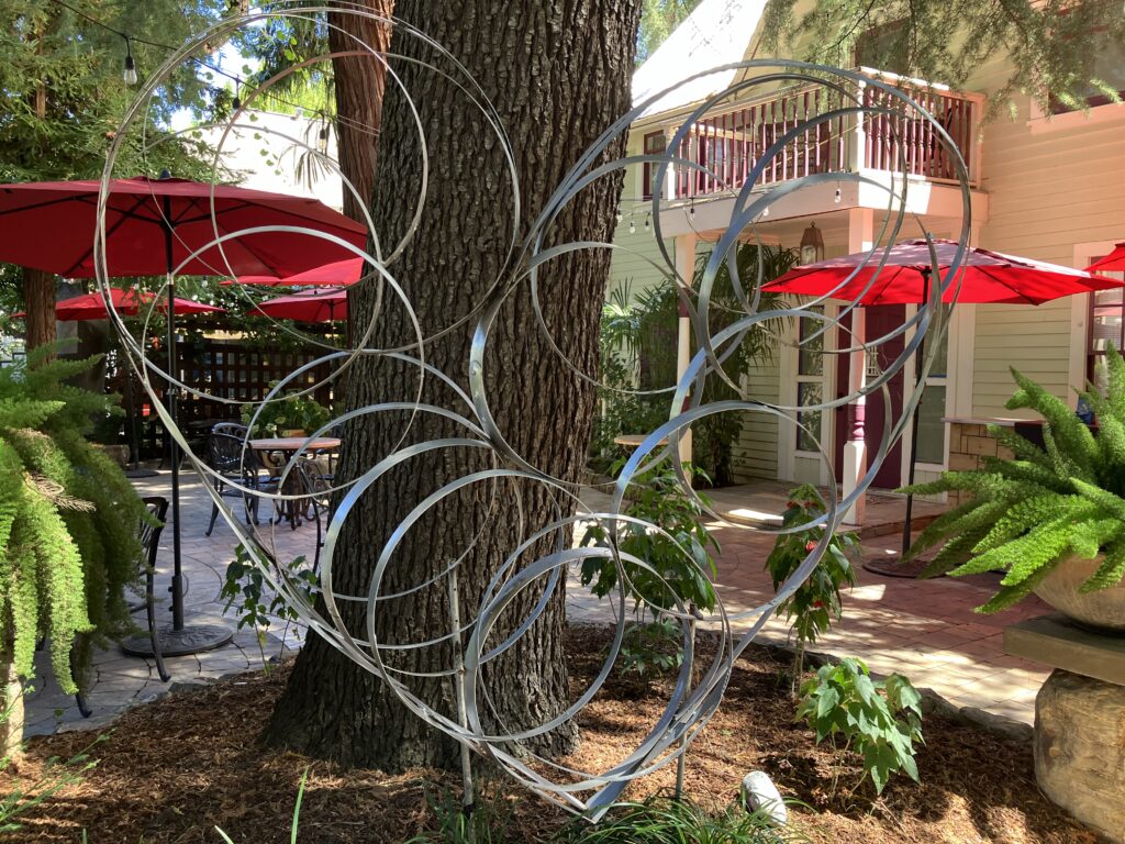 Idyllic outdoor restaurant garden sculpture heart.