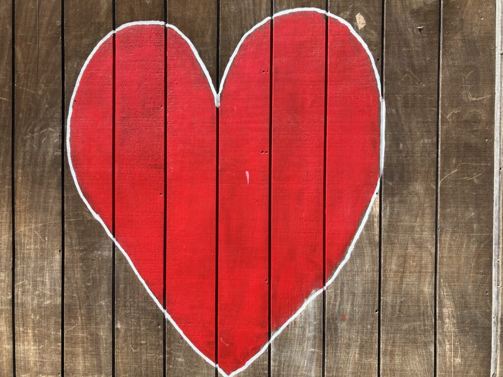 Heart painted on a fence.