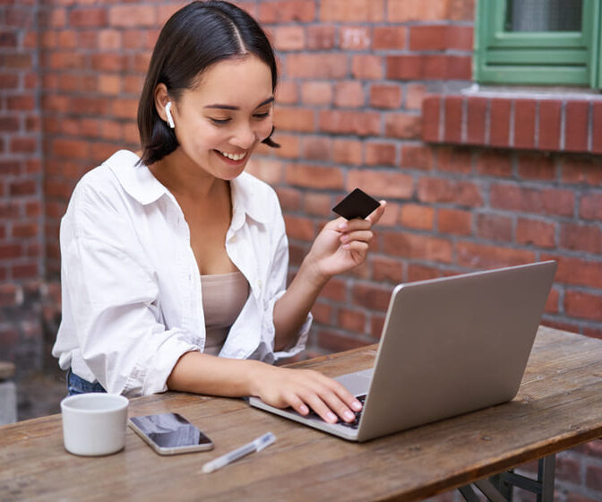 Woman donor with credit card and laptop