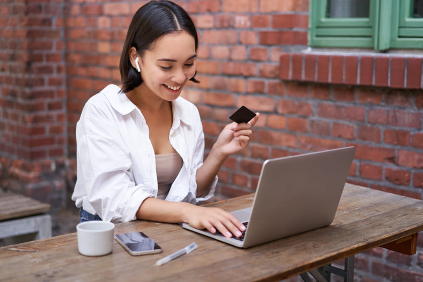 Woman donor with credit card and laptop