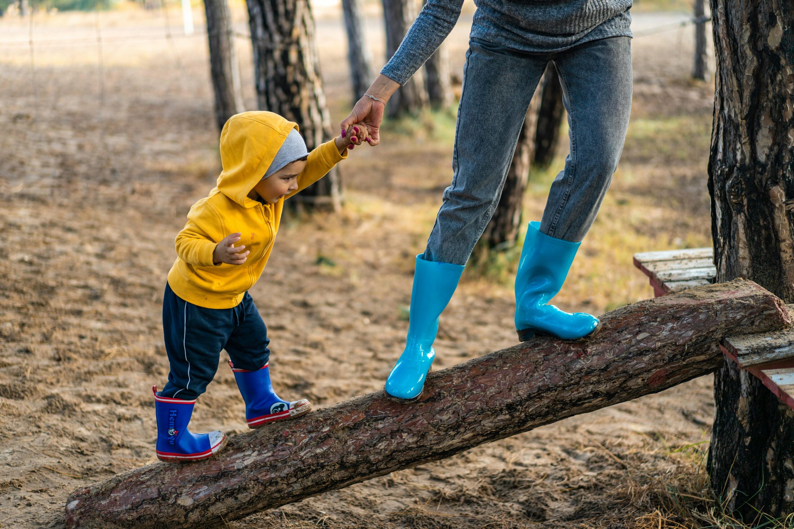 Baby and Mom climbing a tree limb