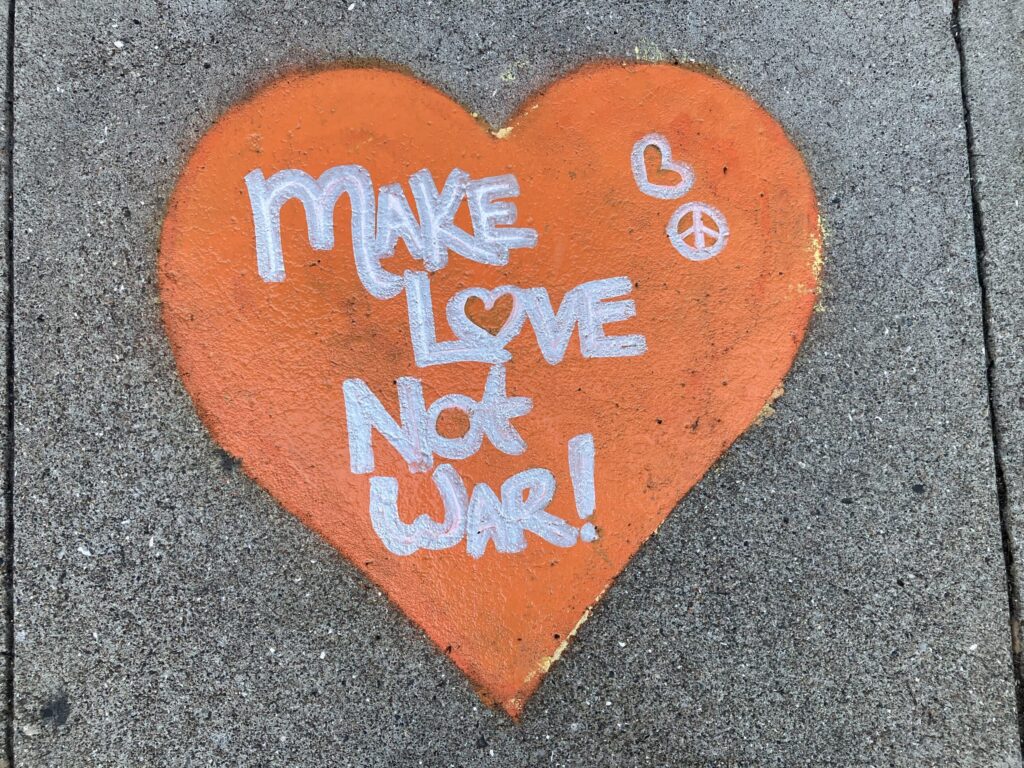 "Make Love Not War" found on a sidewalk.