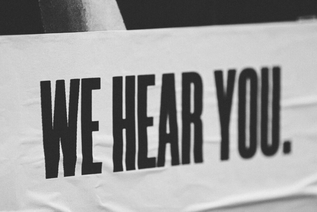 "We Hear You." Banner.