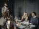 Sommelier serving two couples